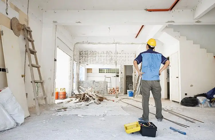 Builder assessing renovation site for Builders Wanaka's Renovations Wanaka service.