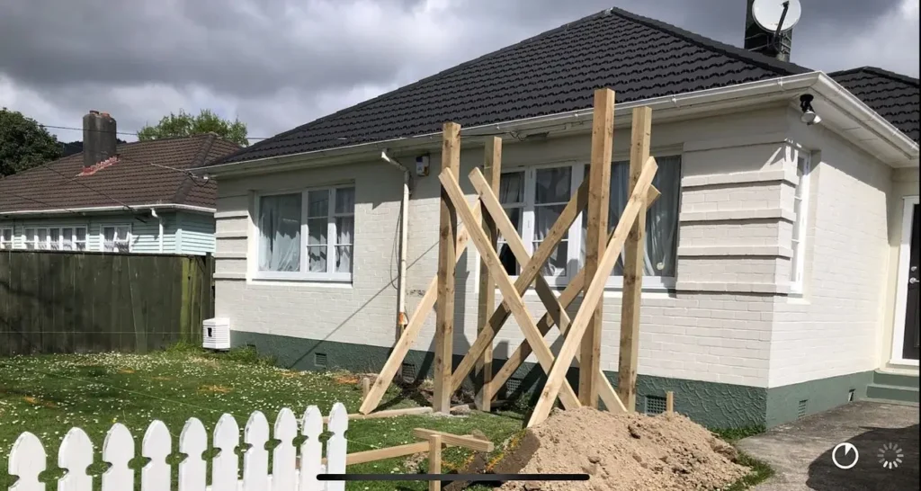Home renovation in progress with wooden beams for structural support by Renovations Wanaka.