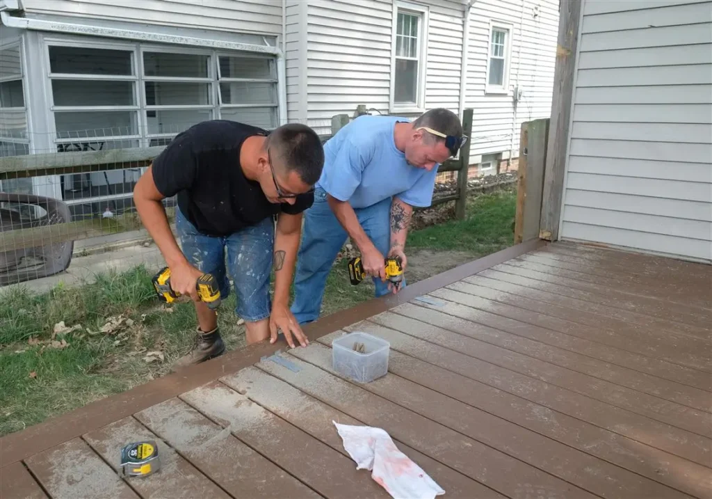 Professionals ensuring precise deck assembly, a hallmark of Deck builders Wanaka at Builders Wanaka.